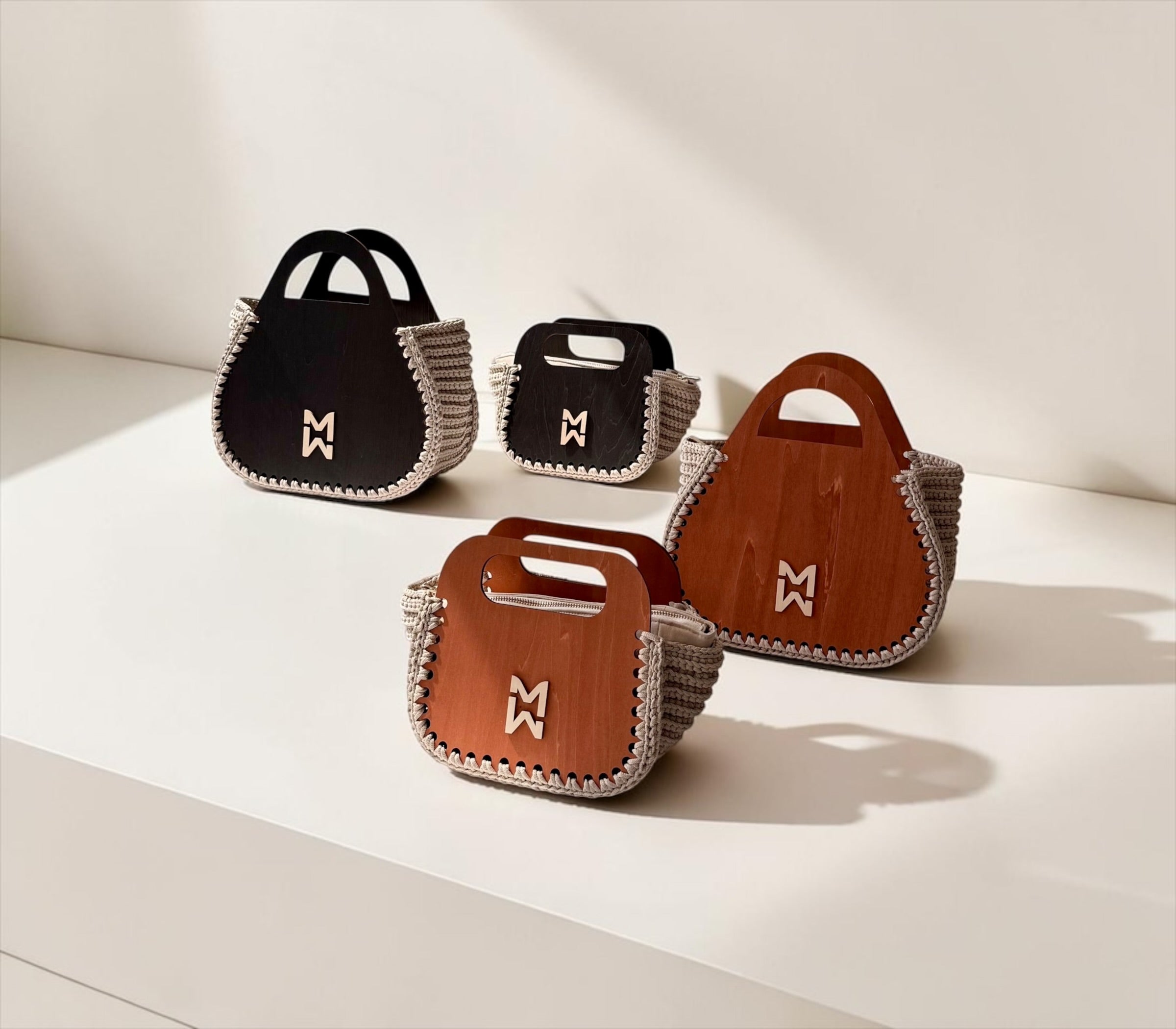 Makafui Adom collection featuring luxury handmade crochet handbags with structured wooden frames in beige.