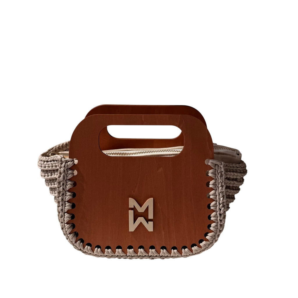 Makafui Adom collection featuring luxury handmade crochet handbags with structured wooden frames in beige.