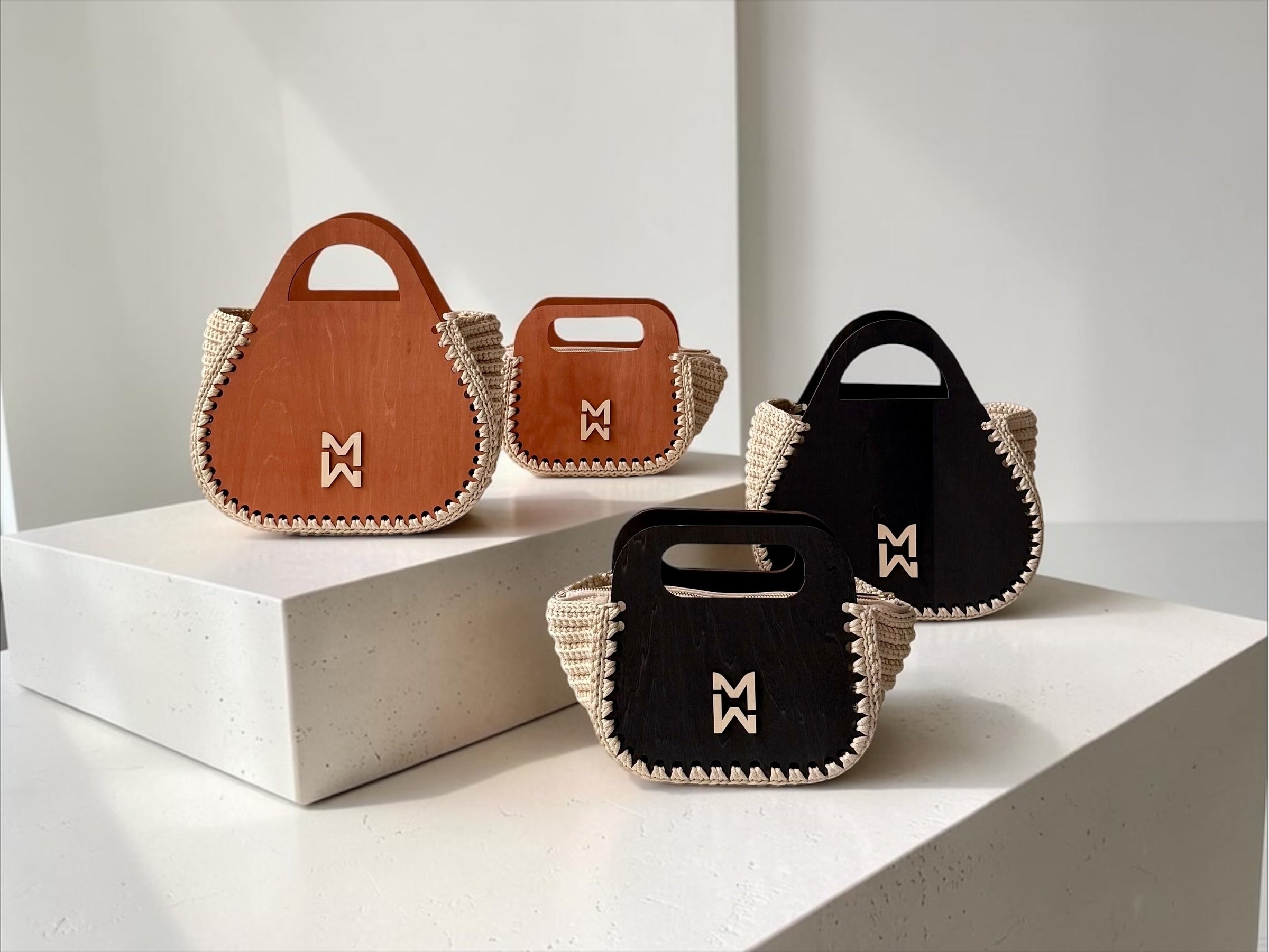 Makafui Ohemaa collection featuring luxury handmade crochet handbags with structured wooden frames in cream.