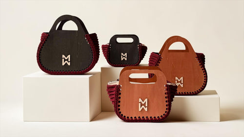 Makafui Sika collection featuring luxury handmade crochet handbags with structured wooden frames in wine.